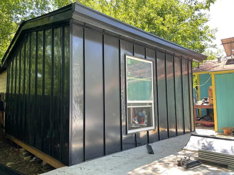 Black standing seam metal wall panels for Roof Inspection in Roxborough Park