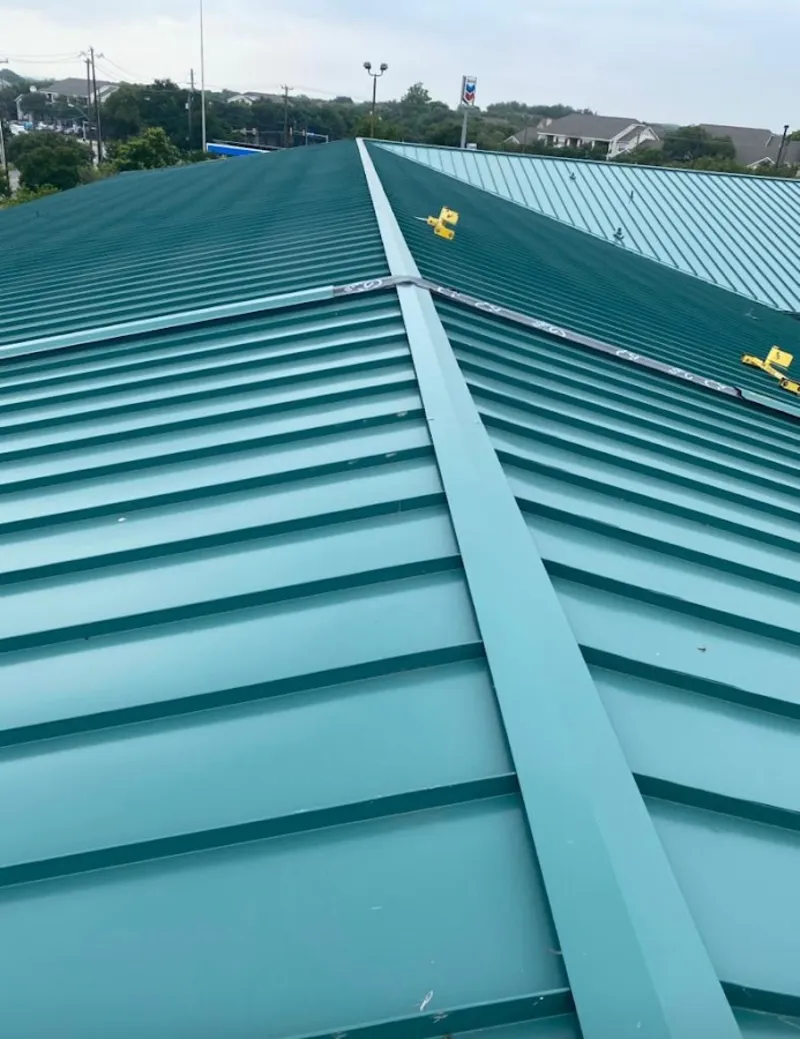 Green commercial metal roof ridge and valley for Metal Roof Repair in Roxborough Park